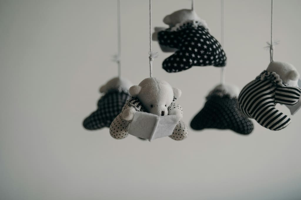 Tiny newborn feet wrapped in a soft blanket — when does implantation happen